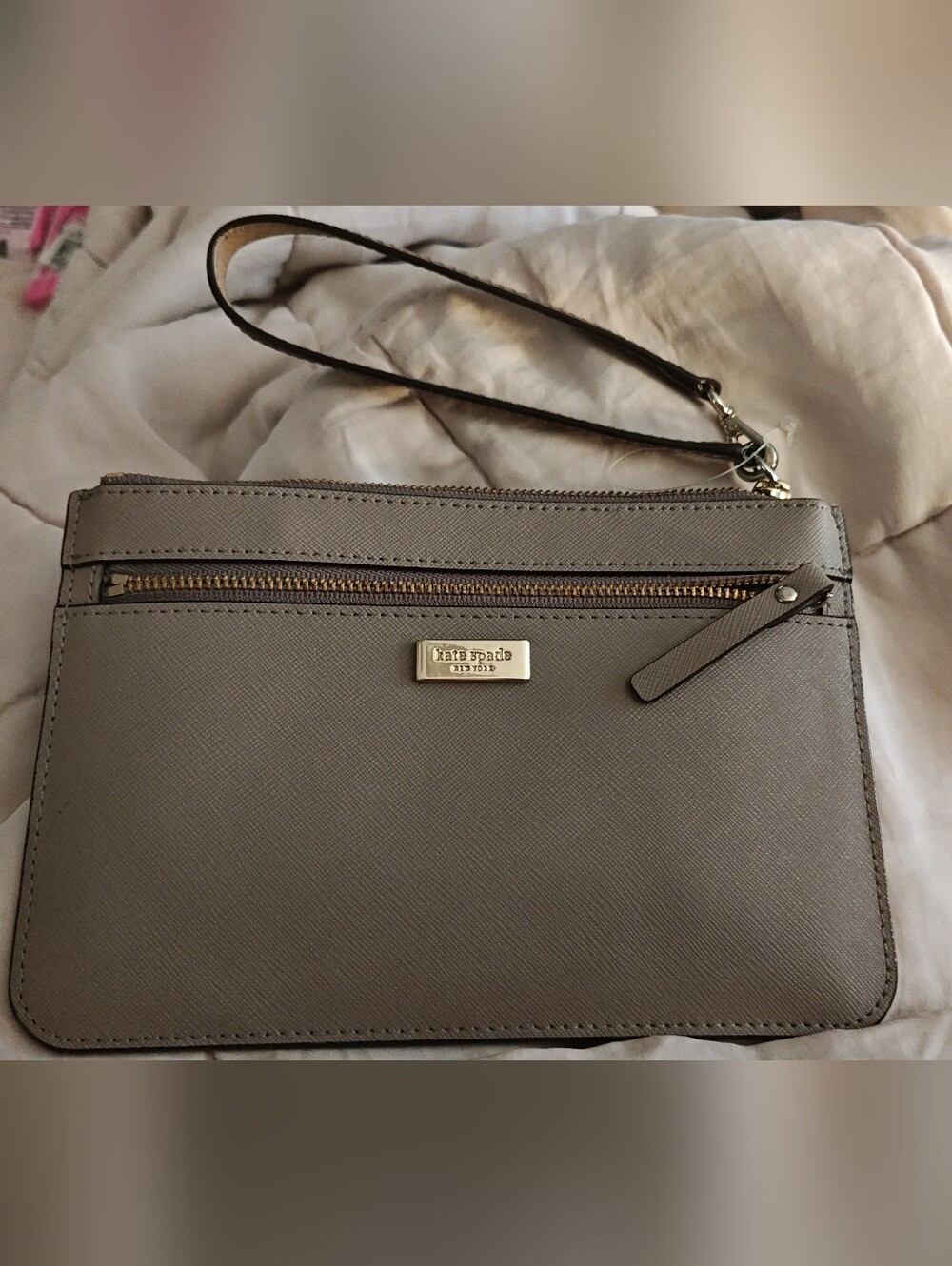 kate Spade taupe saffiano wristlet with gold hardware